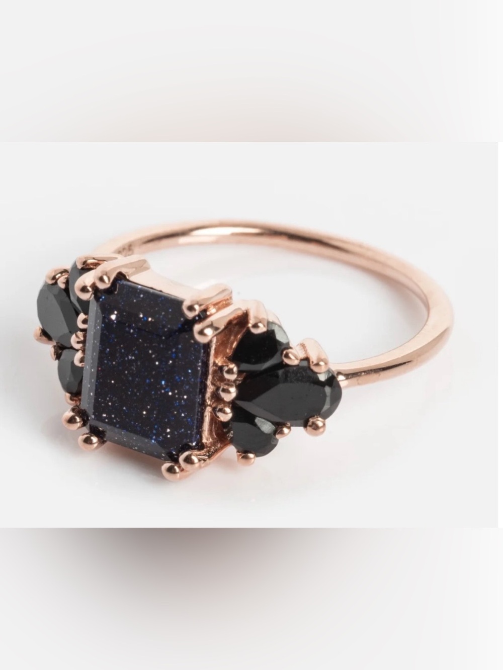 Rose Gold Ring with Dark Blue Center Stone and Black Accents